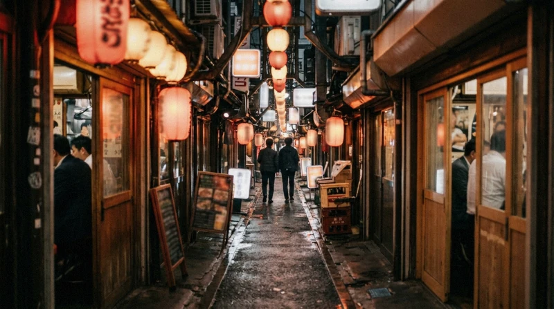 Neon-lit alley of bars in Shinjuku Golden Gai at night on an evening Tokyo city tour